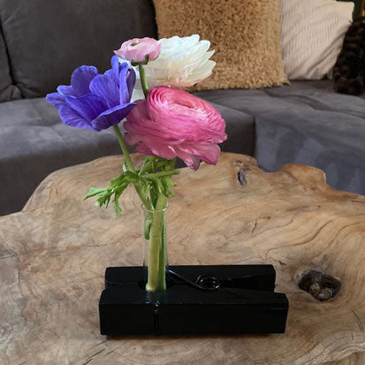 Originele bloemenstandaard met bloemenbuisje